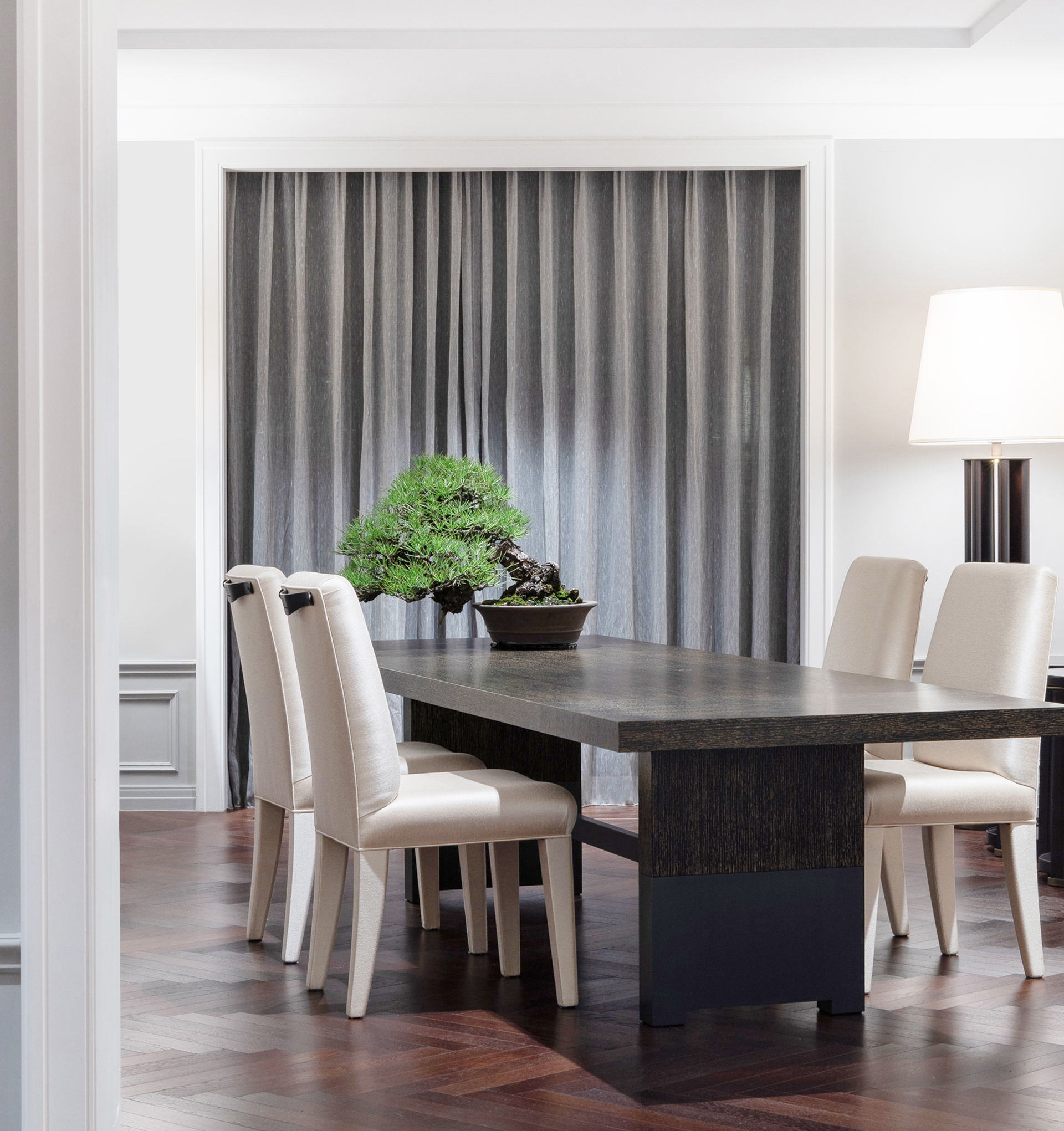 Bamboo is a wooden dining table with a bronze base, from Promemoria's catalogue | Promemoria