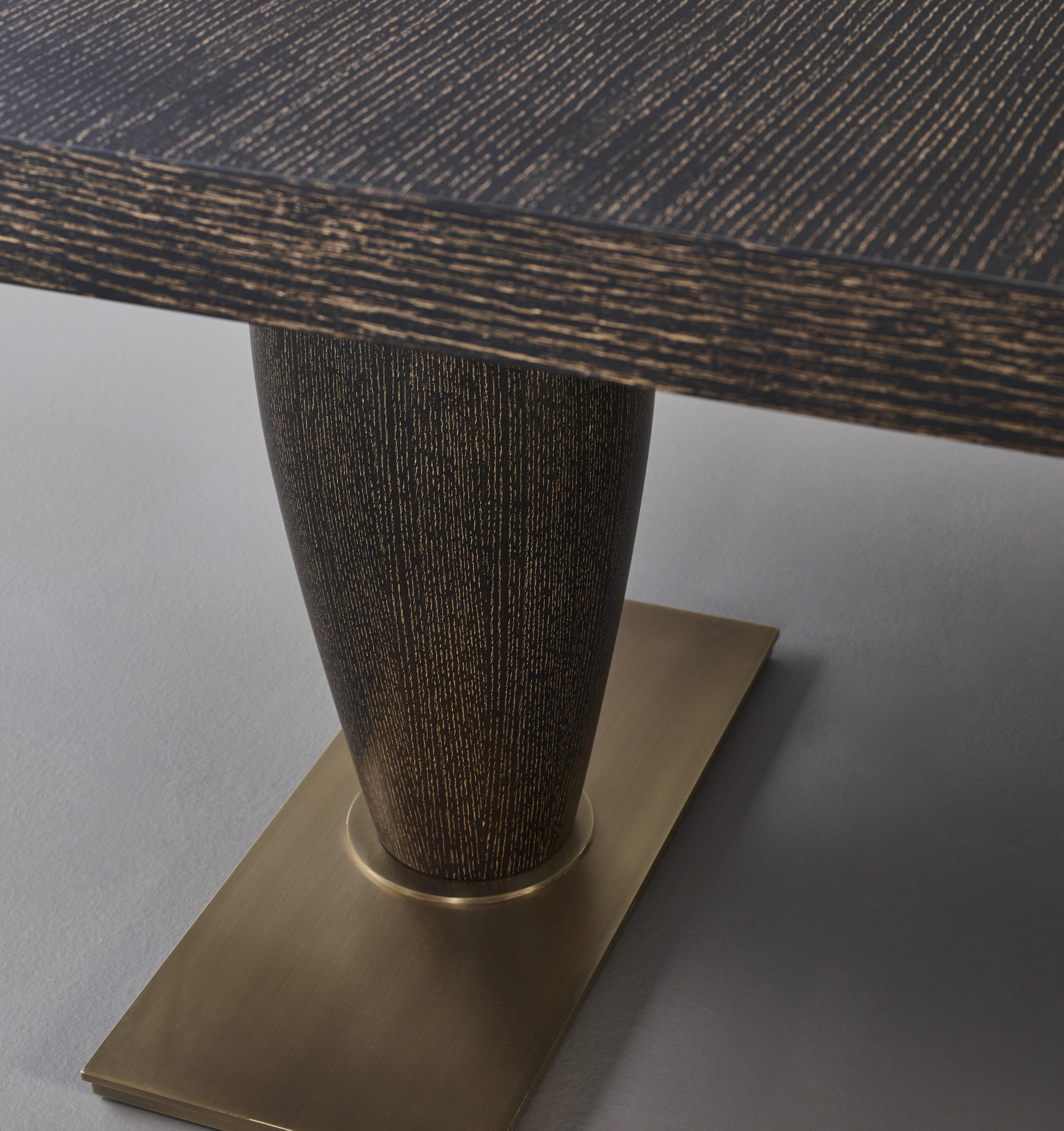 Bassano is an impressive wooden dining table with a bronze base available with inlaid top, from Promemoria's catalogue | Promemoria