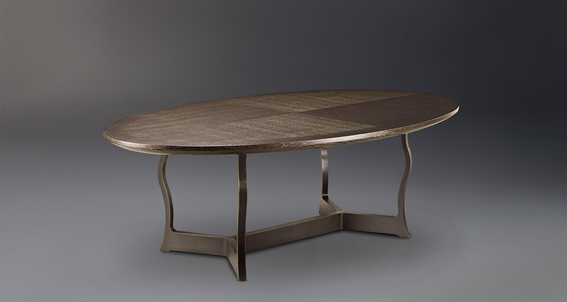 Erasmo is a bronze dining table with wooden or leather top, from Promemoria's catalogue | Promemoria