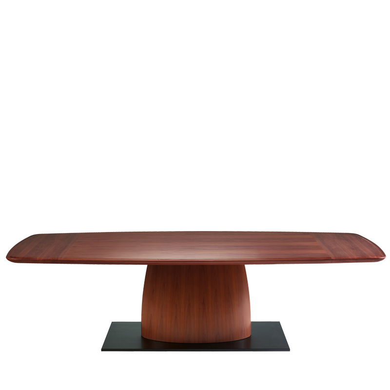 Gerardo est une table de salle à manger en bois, avec piètement-socle en bronze et bords bombés et cannelés. Ce meuble fait partie de la collection « Indigo Tales » de Promemoria | Promemoria
