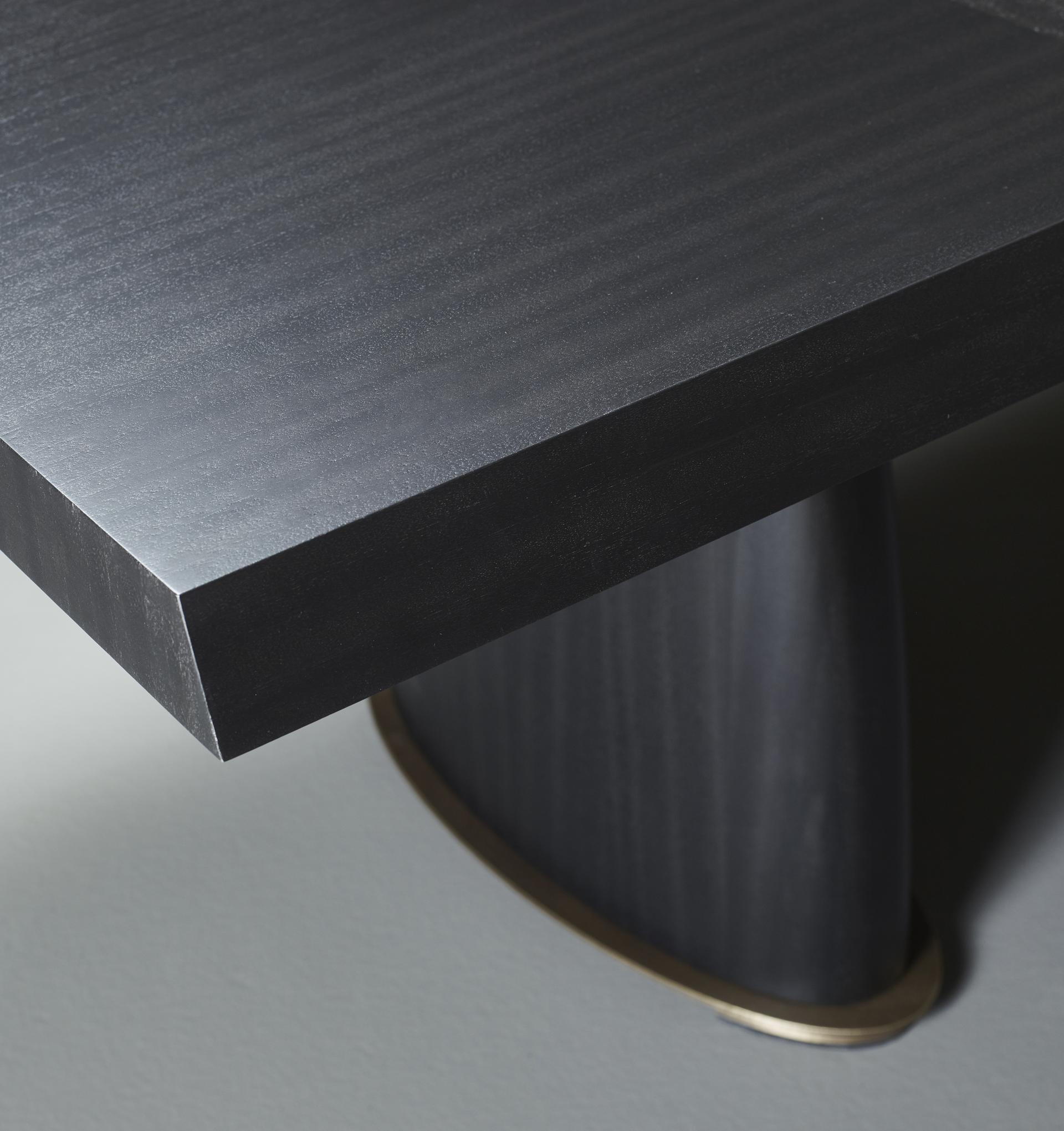 Goffredo is a wooden dining table with a bronze base and checked or striped top, from Promemoria's catalogue | Promemoria