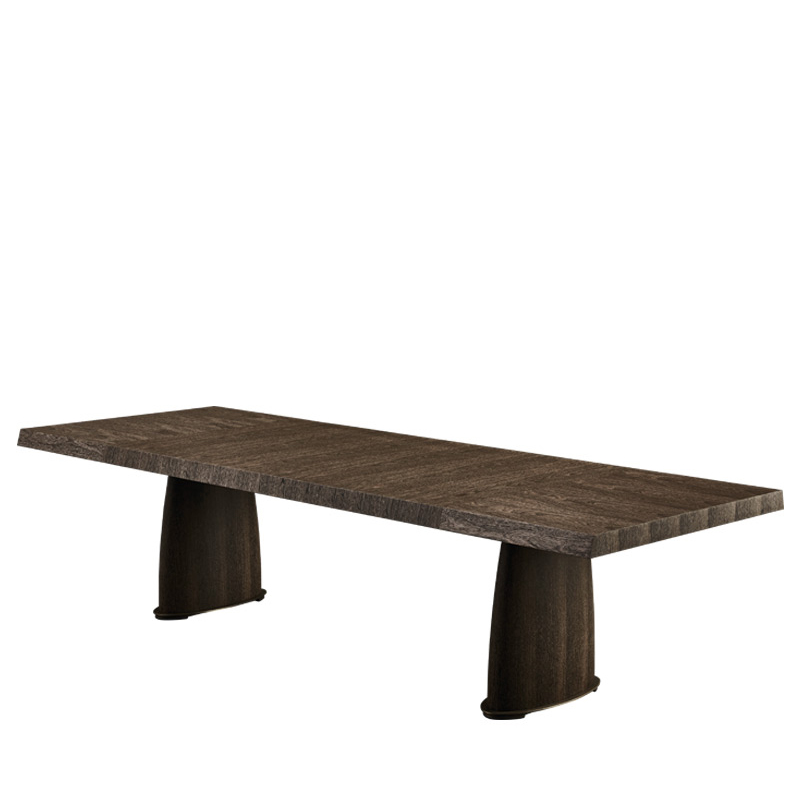 Goffredo est une table de salle à manger en bois avec des finitions en bronze et un plateau avec alternance de veinures ou à veinures. Ce meuble figure dans le catalogue Promemoria | Promemoria