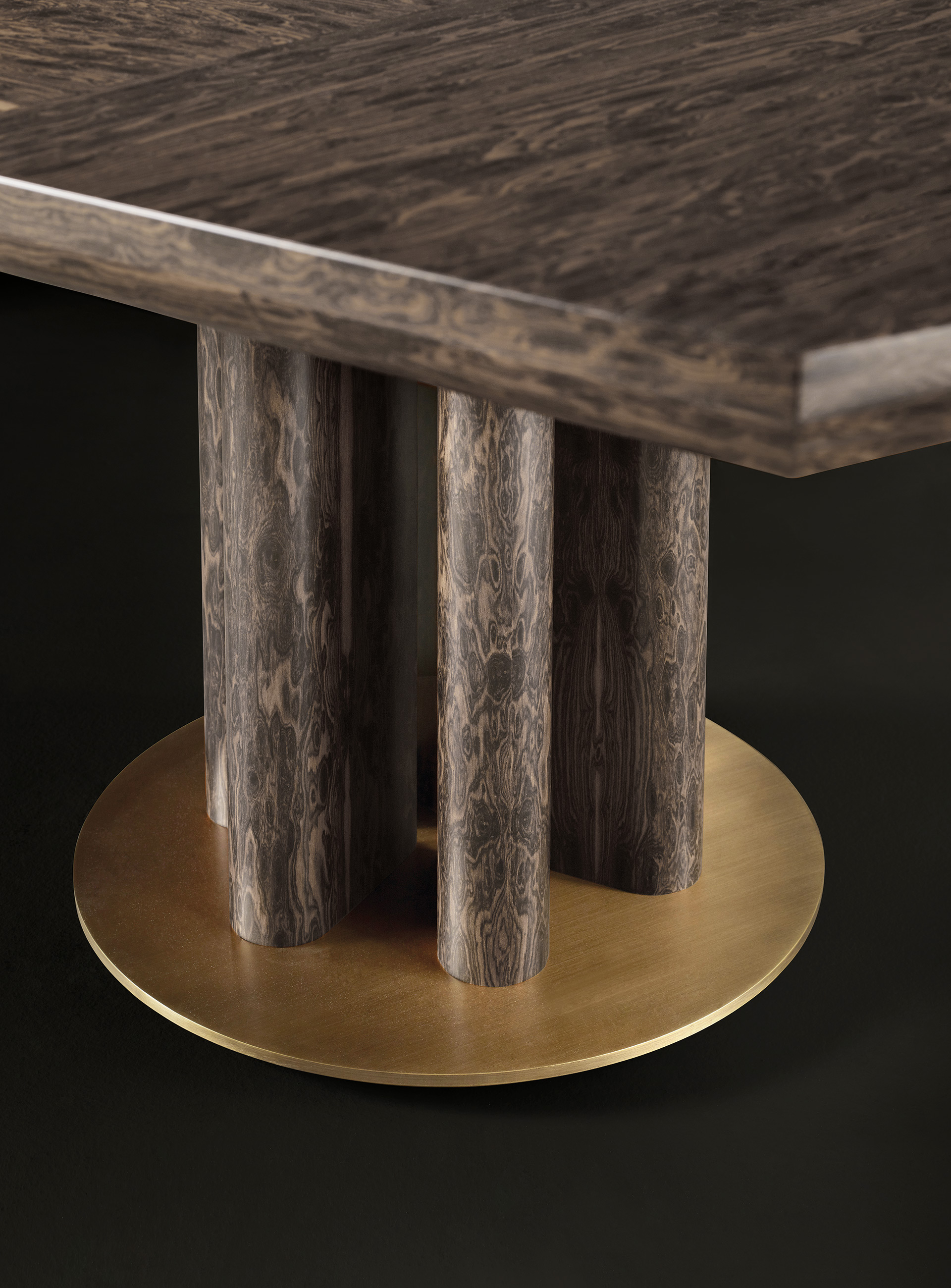Leg and bronze base detail of Orazio, a wooden and bronze dining table, from Promemoria's Amaranthine Tales collection | Promemoria