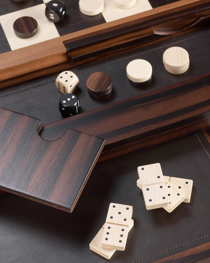 Wooden dominoes, checkers and dice from Bassano da gioco, wooden gaming table with bronze base equipped for several board games, from Promemoria's catalogue | Promemoria