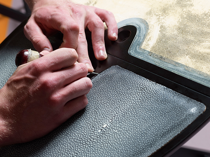 Workmanship detail of Battista, a wooden folding service table that can be covered in leather, from Promemoria's catalogue | Promemoria