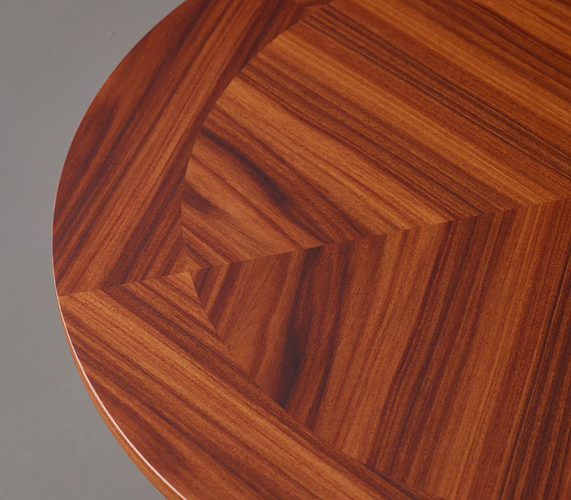 Erasmo is a circular bronze small table with wooden or leather top, from Promemoria's catalogue | Promemoria