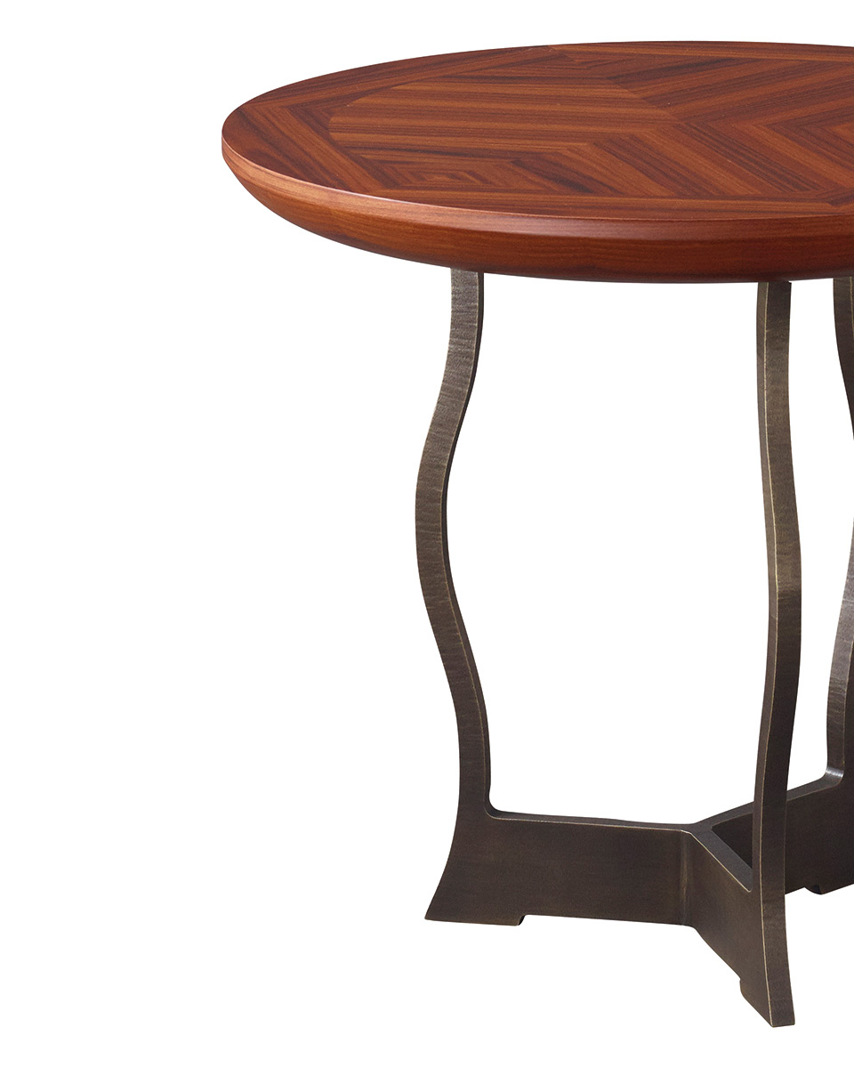Erasmo is a circular bronze small table with wooden or leather top, from Promemoria's catalogue | Promemoria