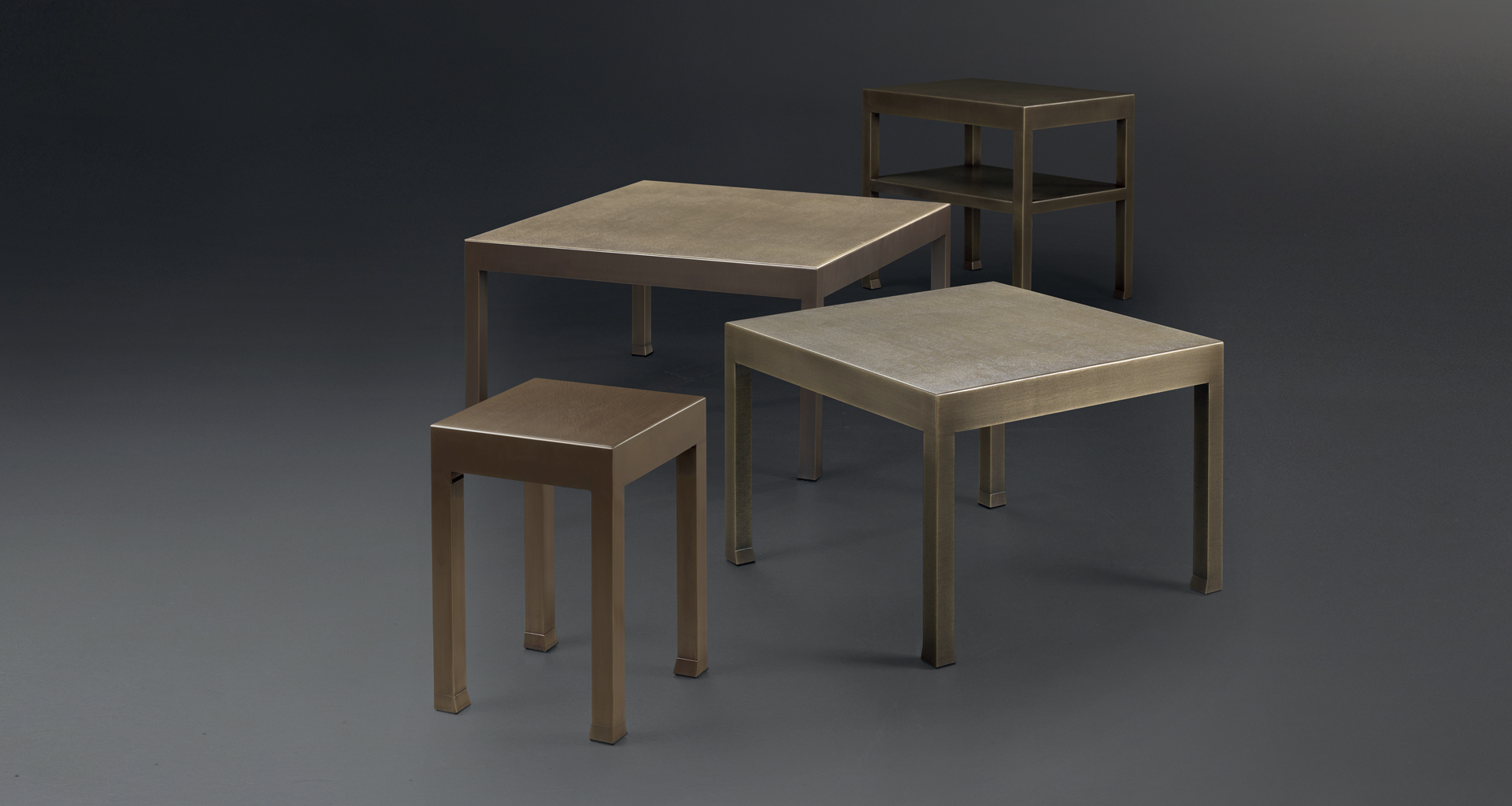 Gong is a bronze small table with glass top, from Promemoria's catalogue | Promemoria