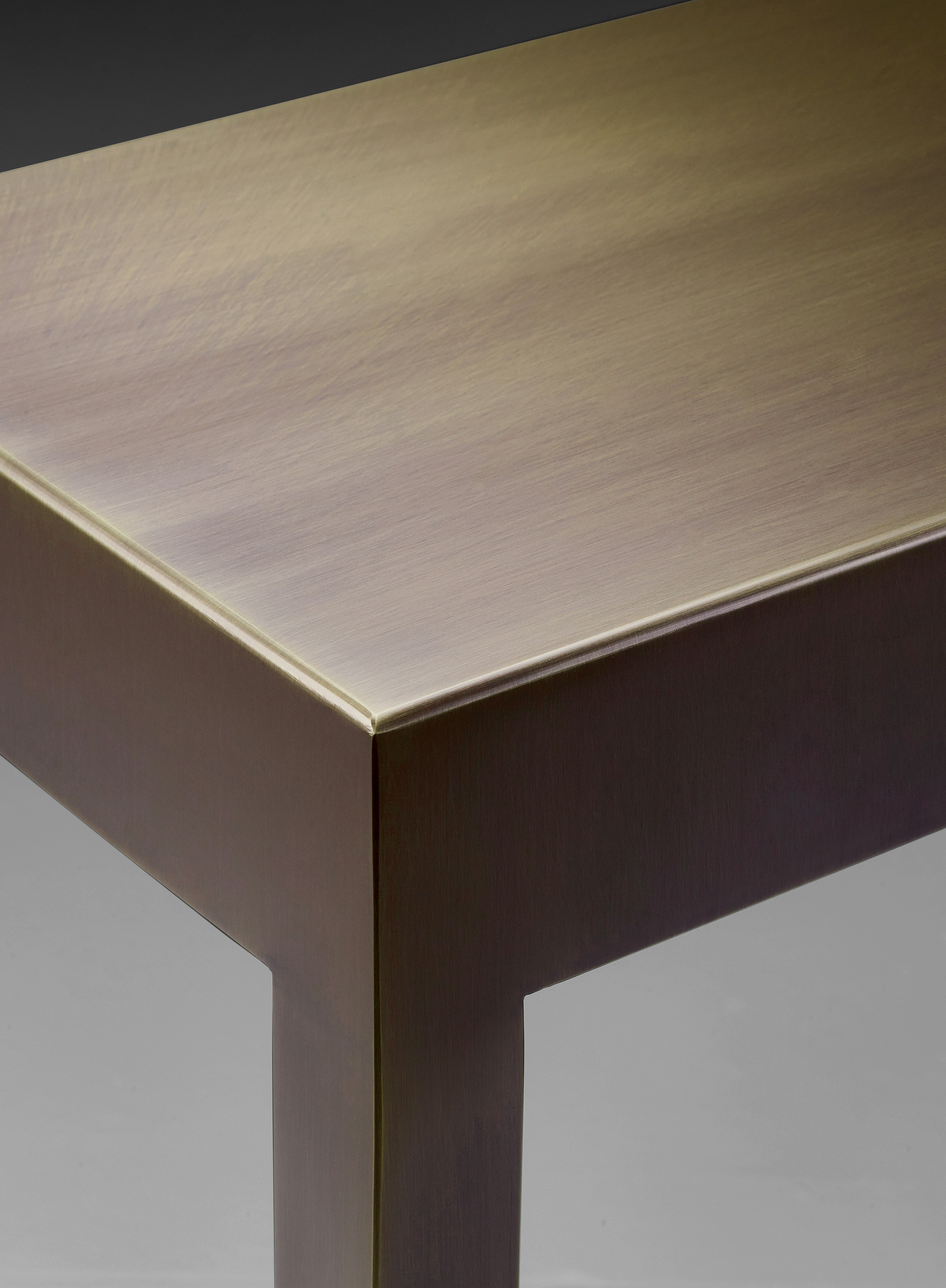 Gong is a bronze small table with glass top, from Promemoria's catalogue | Promemoria