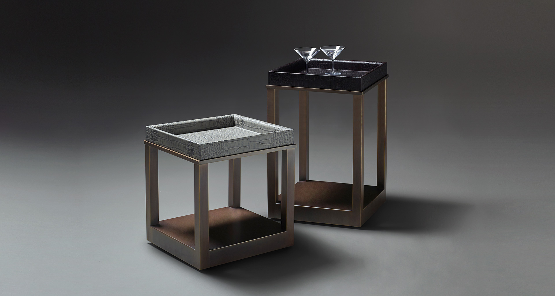 Scarlett is a bronze small table with wheels and a removable leather tray, from Promemoria's catalogue | Promemoria