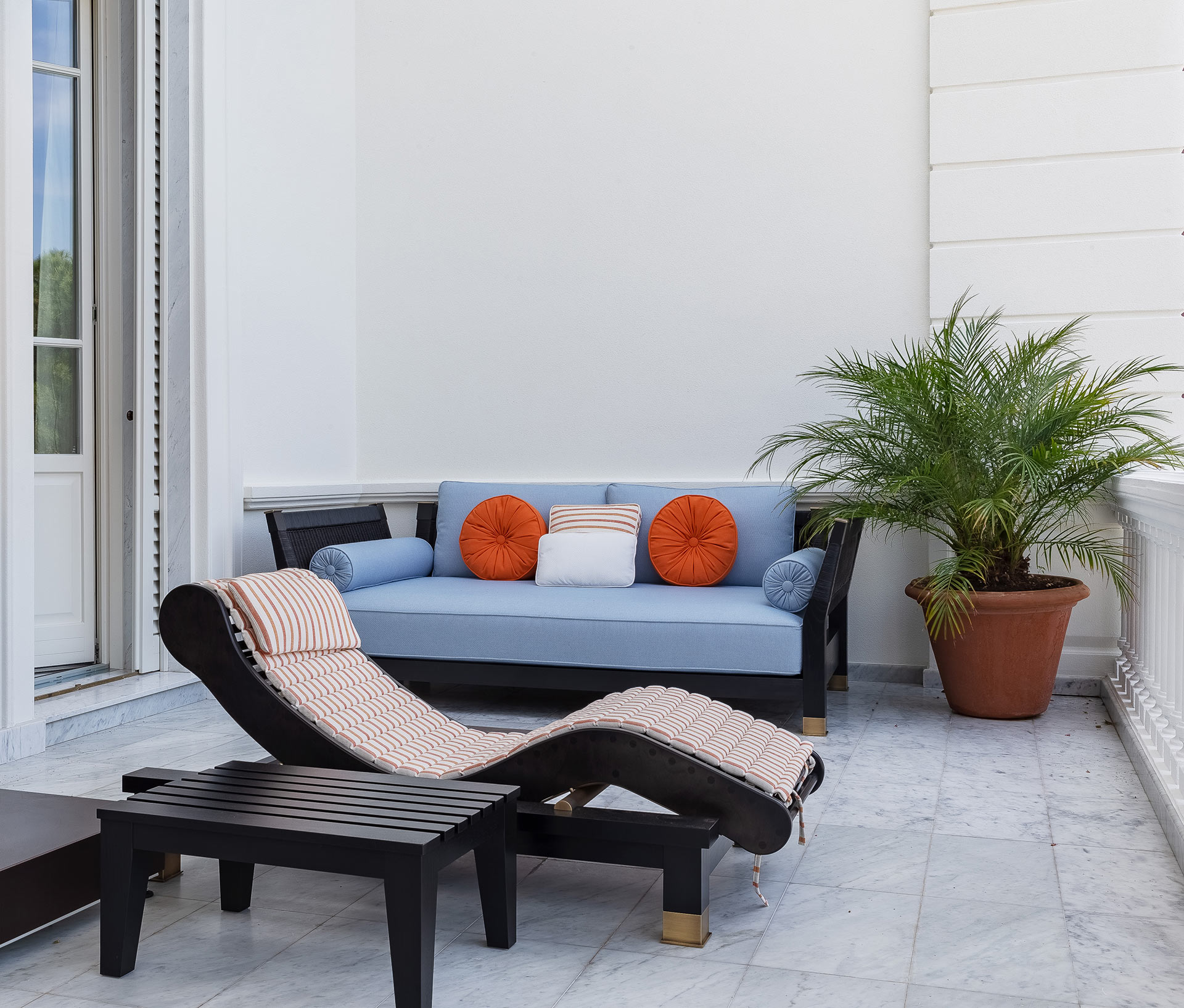 Patio of La Datcha, a luxury resort in Forte dei Marmi, Italy, furnished with Promemoria | Promemoria
