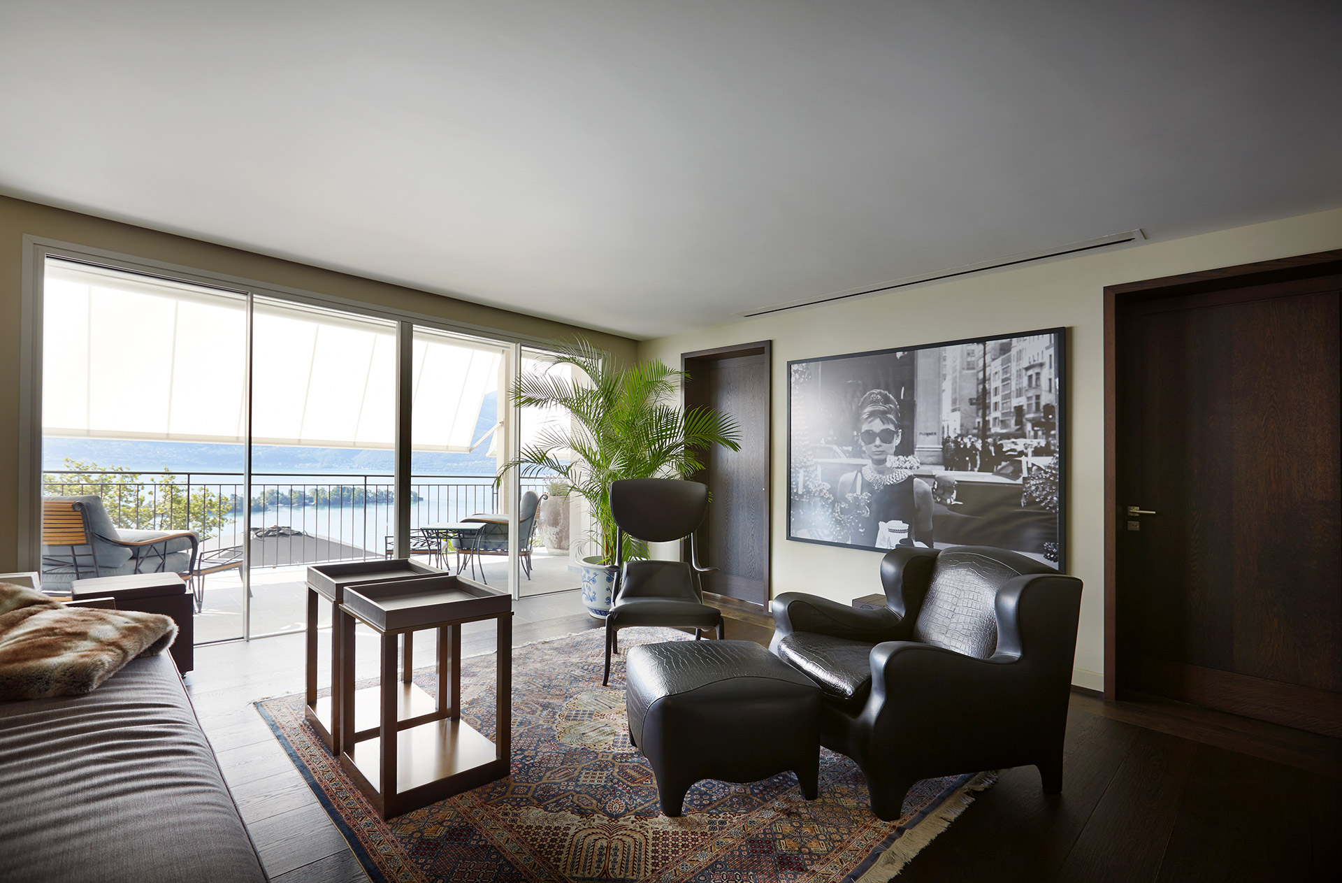 Living room in a private residence in Locarno, Switzerland furnished with Promemoria | Promemoria