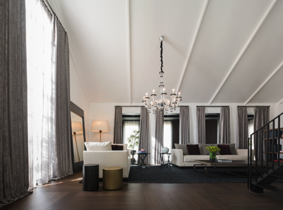 Living room in a showroom in Bangkok, Indonesia, furnished with Promemoria | Promemoria