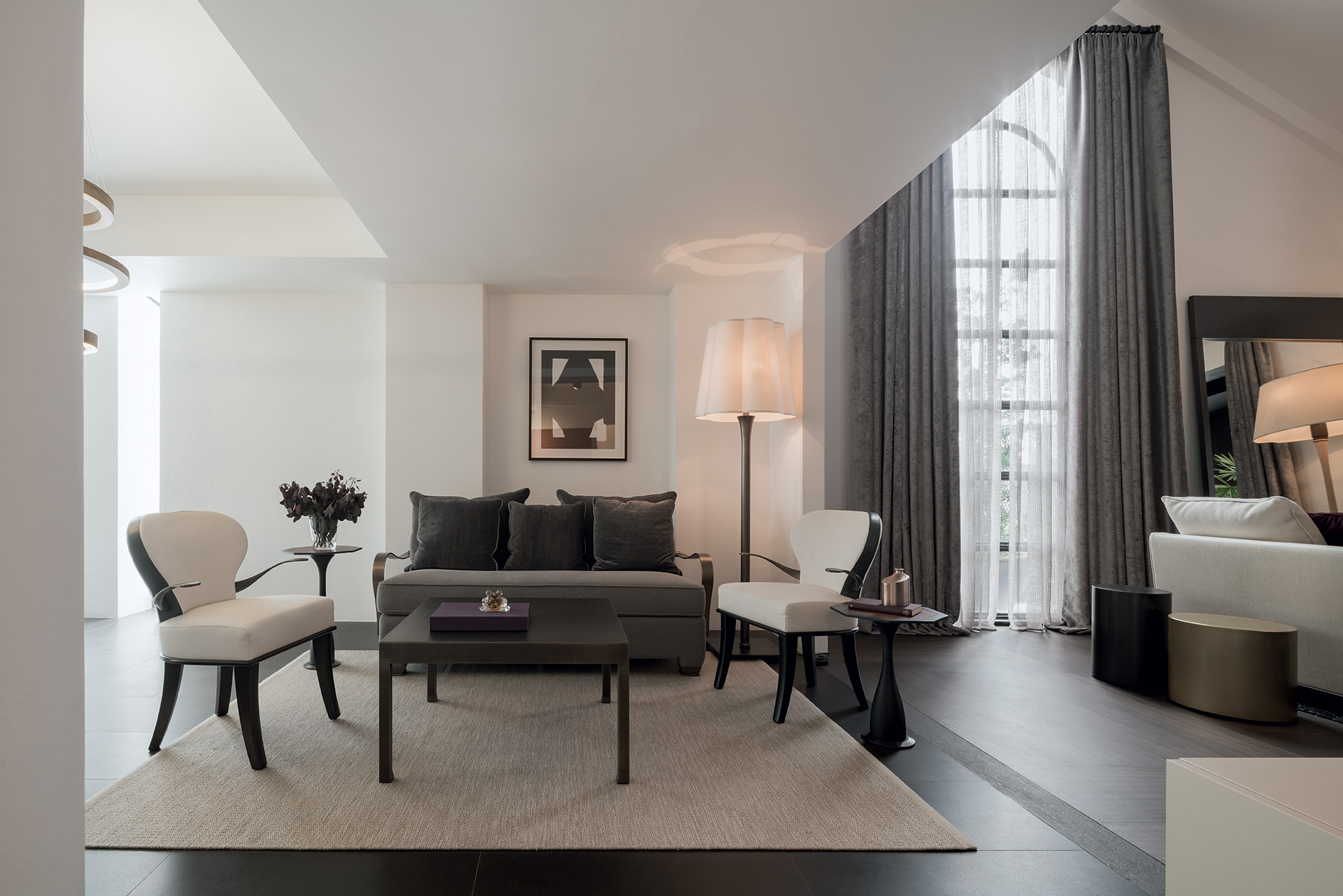 Living room in a showroom in Bangkok, Indonesia, furnished with Promemoria | Promemoria