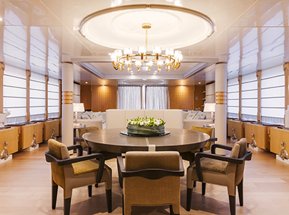 Dining room of a Yacht designed by FM Architettura and furnished with Promemoria | Promemoria